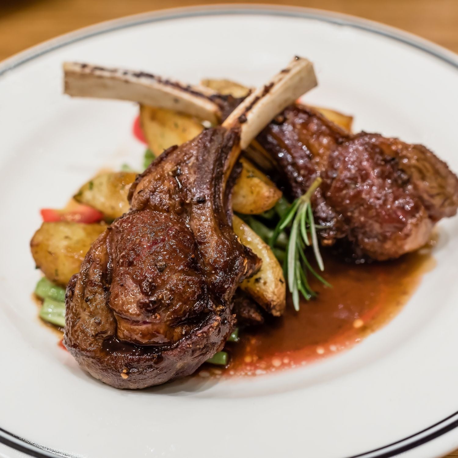 Rack of lamb with red wine sauce on a plate