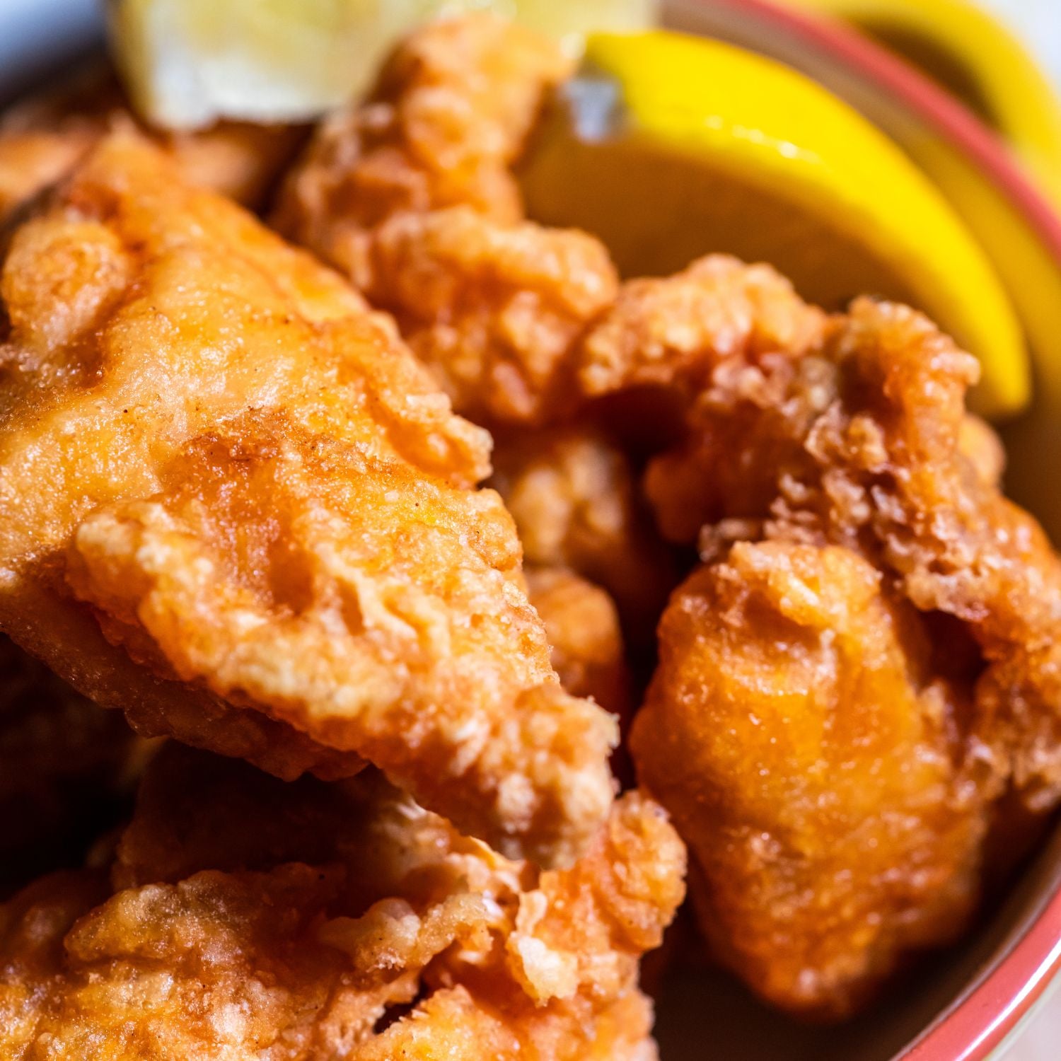A plate of crispy and golden fried chicken that is perfect for a comfort food meal