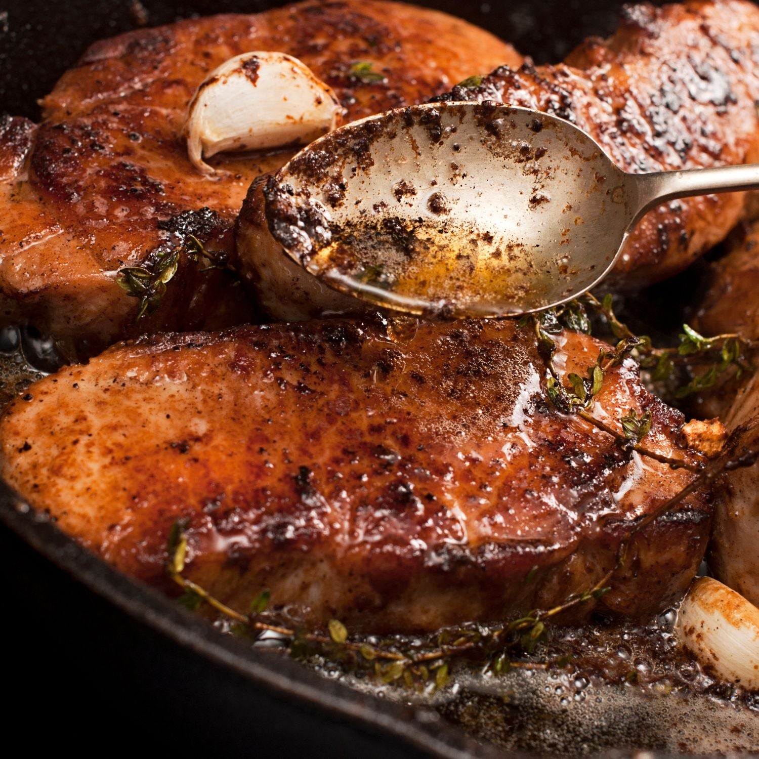 Picture of juicy and delicious pan-fried pork chops with sweet and tangy apple chutney